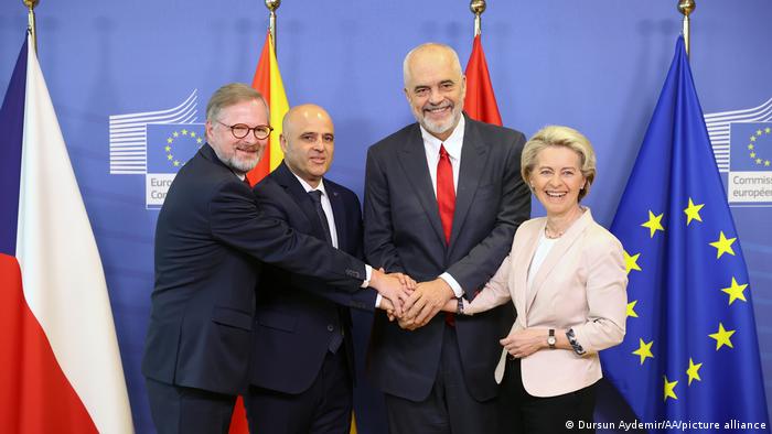 Ursula von der Leyen and the prime ministers of North Macedonia and Albania shake hands