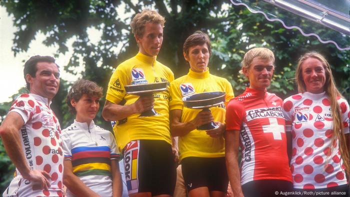 Male and female riders being honored on the same podium at the 1986 Tour