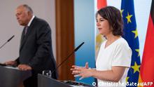 German Foreign Minister Annalena Baerbock (R) and Egyptian Foreign Minister Sameh Shoukry address a joint press conference during the Petersberg Climate Dialogue meeting, at the Foreign Office in Berlin on July 19, 2022. (Photo by Christophe Gateau / POOL / AFP)
