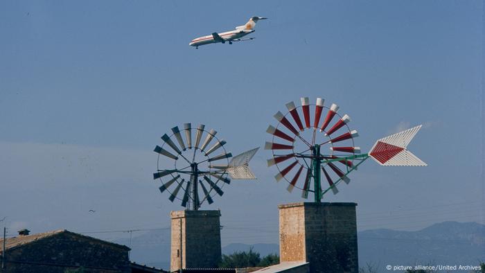 Spain Mallorca Planes over wind mills