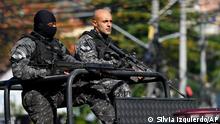 Police carry out an operation in the Complexo do Alemao favela in Rio de Janeiro, Brazil, Thursday, July 21, 2022. Police stormed the favela as part of an operation against cargo theft, according to police. (AP Photo/Silvia Izquierdo)