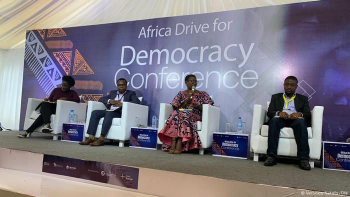 Delegates sitting on the statge at the Africa Drive for Democracy Conference