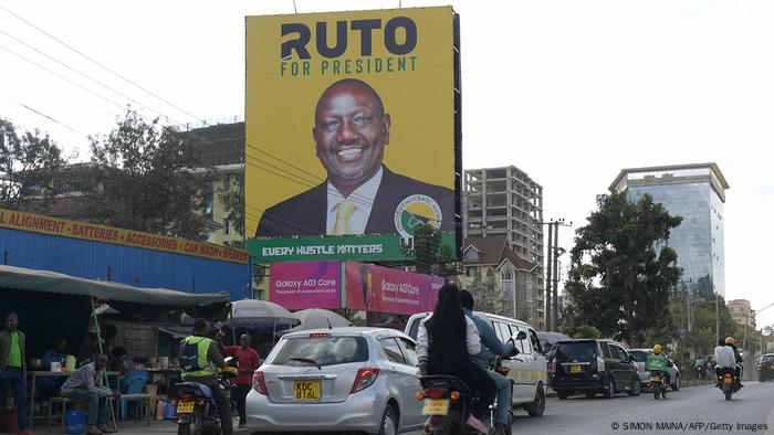 Campaign billboard on a busy street for presidential candidate William Ruto