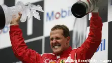 HOCKENHEIM, GERMANY - JULY 30: Michael Schumacher of Germany and Ferrari celebrates on the podium after winning the German Formula One Grand Prix at the Hockenheimring on July 30, 2006 in Hockenheim, Germany. (Photo by Clive Rose/Getty Images)