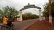A man rides a motorcycle as he drives past the entrance of the Malian army force base in Kati, Mali A man rides a motorcycle as he drives past the entrance of the Malian army force base in Kati, Mali