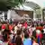 Supporters of Philippine President Ferdinand Marcos Jr. watch his speech in a big screen at a gathering along the Interim Batasang Pambansa Road just outside the House of Representatives Congress in Quezon City in Manila Monday, July 25, 2022