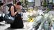 A woman prays for victims in the Akihabara district of Tokyo on the ten-year anniversary of a deadly stabbing attack A woman prays for victims in the Akihabara district of Tokyo on the ten-year anniversary of a deadly stabbing attack