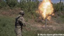 1.7.2022, Gebiet Charkiw, Ukraine, A member of the Carpathian Sich battalion fires a mortar, at the frontline in Kharkiv region, Ukraine, July 1, 2022. The unit must contend with Russian drones - which the fighters refer to as black clouds - that help direct deadly artillery fire onto their positions. REUTERS/Marko Djurica SEARCH DJURICA UKRAINE BATTALION FOR THIS STORY. SEARCH WIDER IMAGE FOR ALL STORIES.