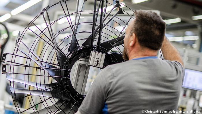 worker in electric fan production plant
