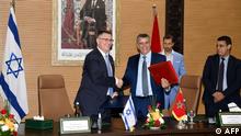 26.07.2022 *** Moroccan Justice Minister Abdellatif Wehbe (R) and Israeli Justice Minister Gideon Saar (L), shake hands after signing an agreement in Rabat on July 26 , 2022. - Israel and Morocco established diplomatic relations in December 2020 as part of the US-backed Abraham Accords, which saw several Arab countries normalise ties with the Jewish state. (Photo by AFP)