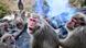 Monkeys warm themselves in an open-air fire at the Japan Monkey Park in Inuyama City Monkeys warm themselves in an open-air fire at the Japan Monkey Park in Inuyama City