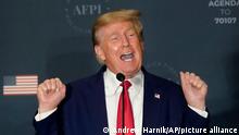 Former President Donald Trump talks about lifting weights as he speaks at an America First Policy Institute agenda summit at the Marriott Marquis in Washington, Tuesday, July 26, 2022. (AP Photo/Andrew Harnik)
