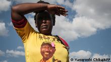 A supporter of Kenya's Deputy President William Ruto wearing a t-shirt with his candidate's face