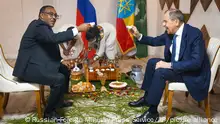 In this handout photo released by Russian Foreign Ministry Press Service, Russian Foreign Minister Sergey Lavrov, right, and Ethiopia's Deputy Prime Minister and Minister of Foreign Affairs Demeke Mekonnen Hassen, during their meeting in Addis Ababa, Ethiopia, Wednesday, July 27, 2022. (Russian Foreign Ministry Press Service via AP)