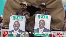 July 18, 2022, Nairobi, Kenya: Kenyan men hold posters of the deputy president of Kenya and United Democratic Alliance (UDA) presidential candidate William Ruto during his campaign rally at the Gikomba market in Nairobi. William Ruto is gunning for the presidency on a United Democratic Alliance (UDA) ticket ahead of the 9th August 2022 Kenya general elections. He will face off 3 other candidates among them is the former prime minister of Kenya and Azimio la Umoja presidential candidate, Raila Odinga. Ruto toured the Gikomba market in Nairobi and lead campaigns to ask for votes at the expansive market together with his Kenya Kwanza allies. (Credit Image: © Boniface Muthoni/SOPA Images via ZUMA Press Wire