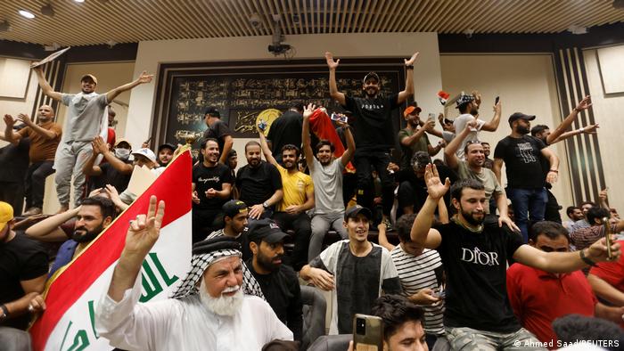 Supporters of Iraqi Shi'ite cleric Moqtada al-Sadr protest against corruption inside the parliament building in Baghdad.