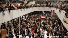 Supporters of Iraqi Shi'ite cleric Moqtada al-Sadr protest against corruption inside the parliament building in Baghdad, Iraq July 27, 2022. REUTERS/Ahmed Saad