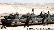 German made Leopard 2 tanks of the Polish army are seen lined up after a joint exercise with the US army at the 21st Rifle Regiment training groun in Nowa Deba, Poland on April 8, 2022. The exercise training was the first of its kind shown to the press and is meant to fortify Poland's military position after the invasion of Ukraine by Russia. (Photo by STR/NurPhoto)