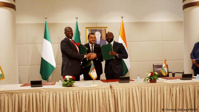 Timipre Sylva, Nigerias Minister of Oil Resources, Mohamed Arkab, Algeria's Minister of Energy and Mines and Sani Mahamadou, Nigers Minister of Energy and Renewable Energy shake hands after signing a MoU on the Trans-Saharan Gas Pipeline