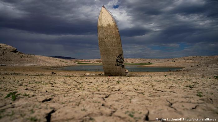 A long-sinking boat stands on dry Lake Mead in the United States