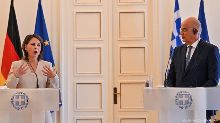 German Foreign Minister Annalena Baerbock alongside her Greek counterpart Nikos Dendias