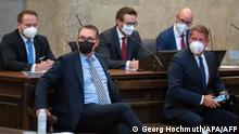Austria's former vice-chancellor and ex-leader of the far-right Freedom Party (FPOe) Heinz-Christian Strache (L) and co-defendant real estate entrepreneur Siegfried Stieglitz (R) sit at court for a session of their trial for corruption in Vienna on July 29, 2022. (Photo by GEORG HOCHMUTH / APA / AFP) / Austria OUT