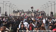 BAGHDAD, IRAQ - JULY 30: Supporters of Iraqi Shiite leader Muqtada al-Sadr begin to demolish concrete barriers to raid Green Zone during a protest against the nomination of new premier Mohammed al-Sudani in Baghdad, Iraq on July 30, 2022. Murtadha Al-Sudani / Anadolu Agency