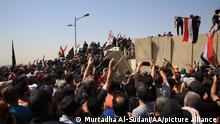 BAGHDAD, IRAQ - JULY 30: Supporters of Iraqi Shiite leader Muqtada al-Sadr begin to demolish concrete barriers to raid Green Zone during a protest against the nomination of new premier Mohammed al-Sudani in Baghdad, Iraq on July 30, 2022. Murtadha Al-Sudani / Anadolu Agency
