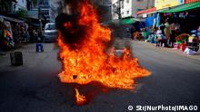  Protest Against Military Junta s Execution Of Pro-Democracy Activists In Myanmar Young demonstrators burn tyres during a protest against the military junta s execution of four pro-democracy activists in Yangon, Myanmar on July 28, 2022. Yangon Myanmar PUBLICATIONxNOTxINxFRA Copyright: xSTRx originalFilename: kyaw-notitle220728_npVC5.jpg