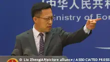 Chinese Foreign Ministry spokesperson Zhao Lijian gestures during a news conference at the Ministry of Foreign Affairs in Beijing, Wednesday, July 27, 2022. China's government on Wednesday rejected as a political lie a report by The Wall Street Journal that Beijing tried to recruit informants in the Federal Reserve system to obtain U.S. economic data. (AP Photo/Liu Zheng)