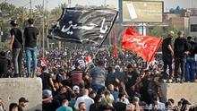 Supporters of the Coordination Framework take part in a counter-protest against Sadr's loyalists who have been occupying the parliament, outside the capital Baghdad's high-security Green Zone on August 1, 2022. - Iraqi security forces were on high alert in Baghdad as tensions soared after rivals of Shiite Muslim cleric Moqtada Sadr, whose supporters are occupying the parliament, called for counter-demonstrations. (Photo by Ahmad Al-rubaye / AFP) (Photo by AHMAD AL-RUBAYE/AFP via Getty Images)