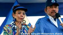 FILE - In this Sept. 5, 2018 file photo, Nicaragua's President Daniel Ortega and his wife, Vice President Rosario Murillo, lead a rally in Managua, Nicaragua. As international health organizations warn of increasing infections in Nicaragua and independent Nicaraguan doctors call for a voluntary quarantine to slow the spread of the delta variant, the government has made clear that comments out of step with its line are unacceptable as Ortega seeks a fourth consecutive term. Murillo has accused doctors of “health terrorism.” (AP Photo/Alfredo Zuniga, File)