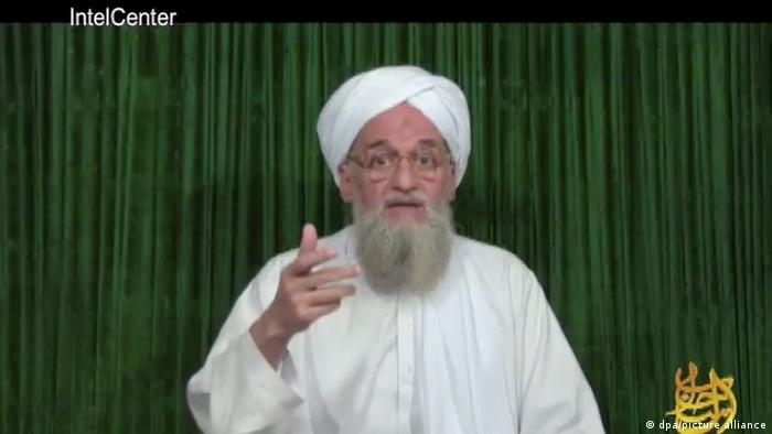 A screenshot from 2012 showing a video message by Ayman al-Zawahri, who is gesturing at the camera