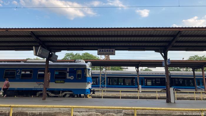 Zagreb station with platforms and trains stopped at the platforms.