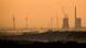 Mehrum coal power plant seen from a distance, surrounded by wind turbines Mehrum coal power plant seen from a distance, surrounded by wind turbines