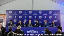 President of CONMEBOL Alejandro Dominguez, second from left, speaks next to Ignacio Alonso, President of the Uruguayan Football Association, third from left, and Uruguay's Sports Minister, Sebastian Bauza, second from left, AFA Vicepresident Rodolfo Donofrio, right, and Paraguay's FPF President Robert Harrison, left, during a press conference for a joint bid to host the 2030 FIFA World Cup with the hope of bringing the global showpiece back to its first home at Centenario Stadium in Montevideo, Uruguay, Tuesday, Aug. 2, 2022. (AP Photo/Matilde Campodonico)