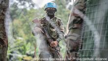 MONUSCO blue helmet deployed near Kibumba, north of Goma, Democratic Republic of Congo, Saturday Jan. 28, 2022. Thousands of people in the Democratic Republic of Congo have been displaced after they fled ongoing clashes between the Congolese army and M23 fighters this week. (AP Photo/Moses Sawasawa)