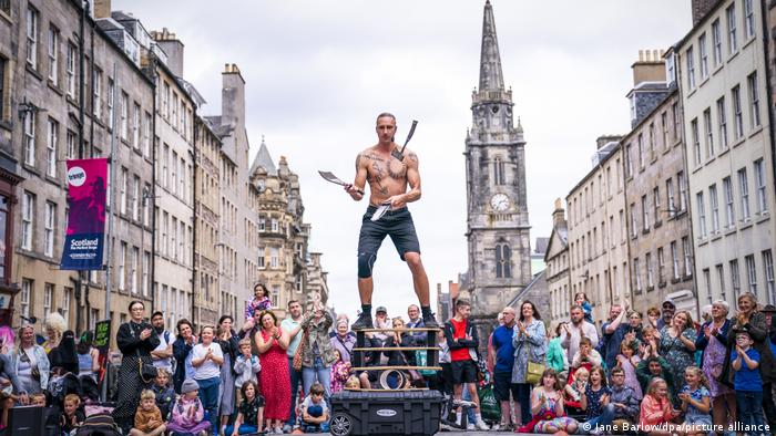 Circus street performer 'Reidiculous' juggles on the Royal Mile before the start of this year's Edinburgh Fringe Festival