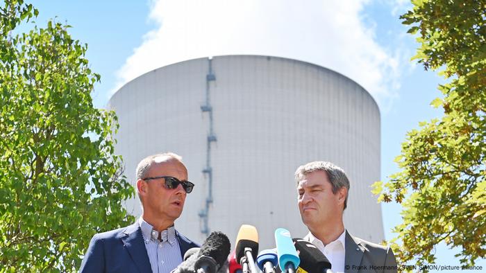 Friedrich Merz and Markus Söder outside the Isar 2 power plant