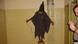 A photo from Abu Ghraib prison in Iraq showing a white male in US army fatigues in the foreground and another man, an Iraqi, hooded and standing on a crate, with electrical wires attatched to his hands A photo from Abu Ghraib prison in Iraq showing a white male in US army fatigues in the foreground and another man, an Iraqi, hooded and standing on a crate, with electrical wires attatched to his hands