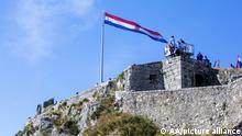 KNIN, CROATIA - AUGUST 05: Croatians gather to mark the 26th anniversary of Operation Storm (Oluja) at Castle of Knin in Croatia on August 05, 2021. Croatian flag was unfurled from the castle. Stringer / Anadolu Agency