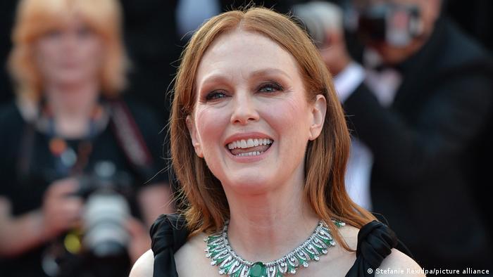 Julianne Moore looks into the camera and smiles
