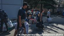 BAKHMUT, UKRAINE - AUG 4: People wait for buses in order to be evacuated in Bakhmut, Ukraine, 4 August 2022. Diego Herrera Carcedo / Anadolu Agency