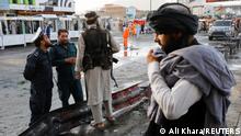 Taliban fighters stand guard at the site of a blast in Kabul, Afghanistan, August 6, 2022. REUTERS/Ali Khara