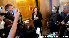 US Vice President Kamala Harris speaks to reporters while departing the Senate Chamber at the US Capitol in Washington, DC, on August 6, 2022. - Harris broke a 50-50 vote in the US Senate to proceed on the Inflation Reduction Act. After 18 months, a possible victory for Joe Biden's social and climate reform legislation seems within reach: Congress on August 6 began debating a revised version of the US president's cornerstone bill, the fruit of numerous compromises with those on his party's right. (Photo by Stefani Reynolds / AFP)