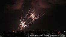 Rockets seen in the sky fired by Palestinian militants toward Israel, over Gaza City, Saturday, Aug. 6, 2022. The latest confrontation between Israel and Gaza militants is in its second day, as Israeli jets hit targets in Gaza and rocket fire persists into southern Israel. Palestinian officials say at least 15 people have been killed in Gaza, including a senior militant leader and a 5-year-old girl. (AP Photo/Adel Hana)