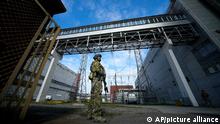 A Russian serviceman guards an area of the Zaporizhzhia Nuclear Power Station in territory under Russian military control, southeastern Ukraine, Sunday, May 1, 2022. (AP Photo)