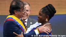 Colombia's new President Gustavo Petro (L) and Vice-president Francia Marquez greet during the inauguration ceremony at the Bolivar square in Bogota, on August 7, 2022. - Ex-guerrilla and former mayor Gustavo Petro was sworn in as Colombia's first-ever leftist president, with plans for profound reforms in a country beset by economic inequality and drug violence. (Photo by JUAN BARRETO / AFP) (Photo by JUAN BARRETO/AFP via Getty Images)
