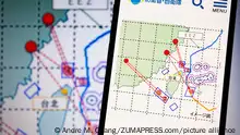 August 4, 2022, Asuncion, Paraguay: A map released by Japan Ministry of Defense showing what it believes are missiles launched by China that landed in Japan's EEZ, displayed on a smartphone and screen. China appears to have launched nine ballistic missiles from around 15:00 to after 16:00 on Thursday. Five of them appear to have landed in Japan's Exclusive Economic Zone (EEZ), according to Japan Ministry of Defense. The missiles were launched during live-fire military exercises conducted by China around Taiwan following U.S. House Speaker Nancy Pelosi's visit to Taipei. (Credit Image: Â© Andre M. Chang/ZUMA Press Wire