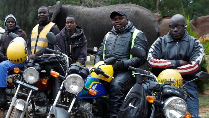 Motorcycle taxi riders wait for clients at a bay outside the WestGate shopping mall in the Westlands district of Nairobi, Kenya.